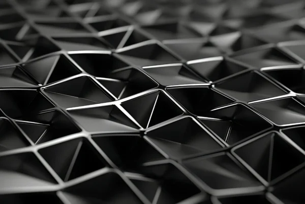 Composición tridimensional de formas geométricas negras y grises sobre fondo claro