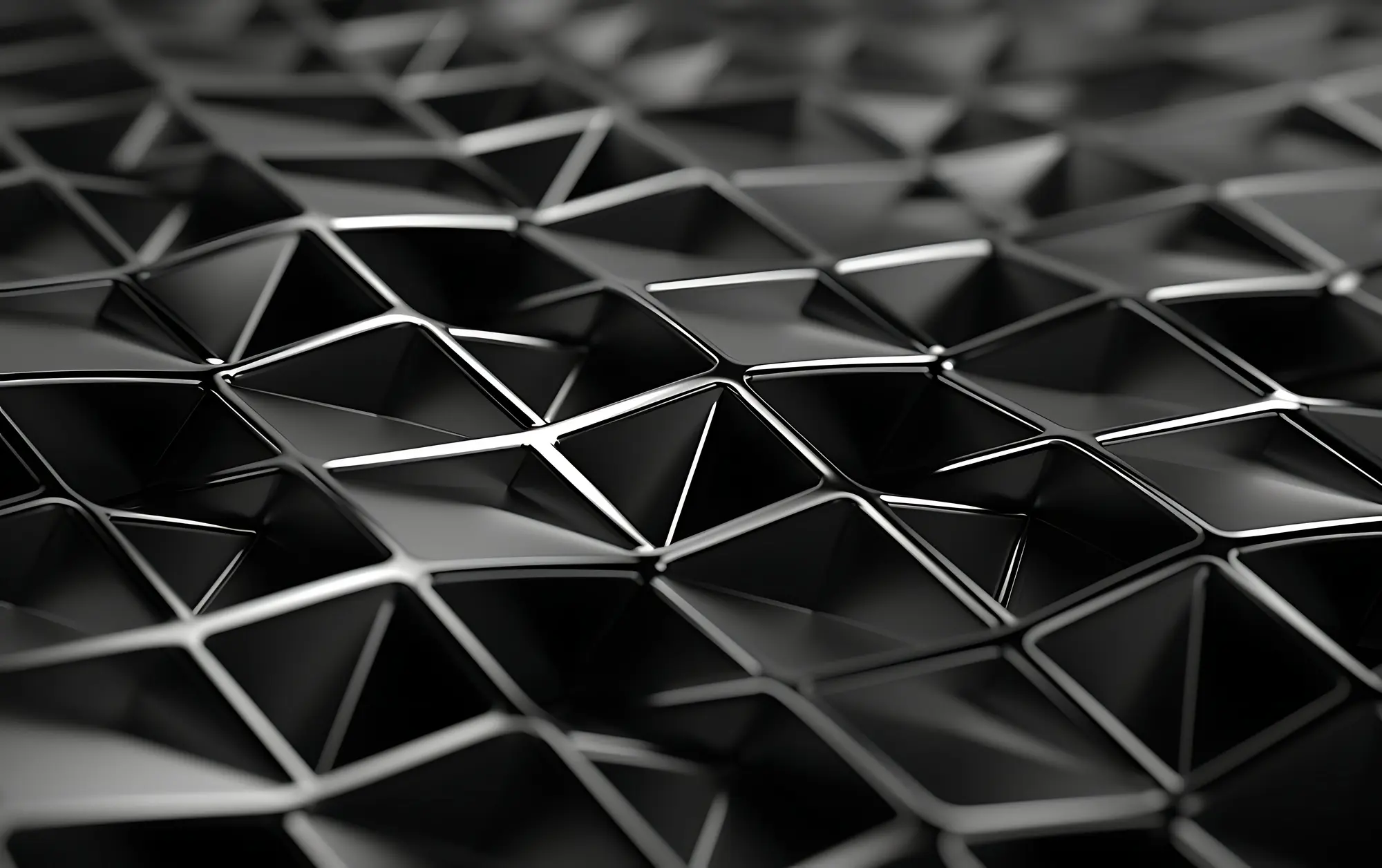Composición tridimensional de formas geométricas negras y grises sobre fondo claro